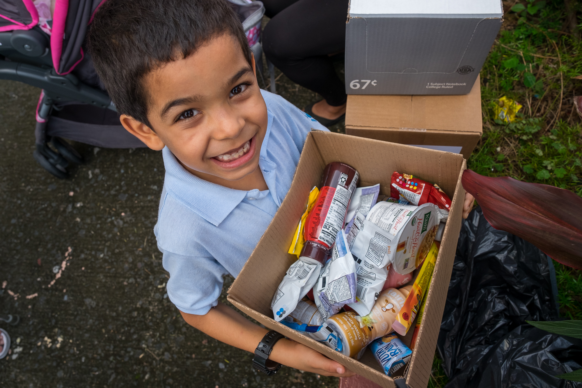 Boy holding a food donation box